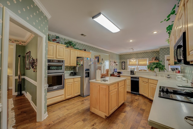 kitchen featuring appliances with stainless steel finishes, a kitchen island, light wood-type flooring, decorative light fixtures, and ornamental molding