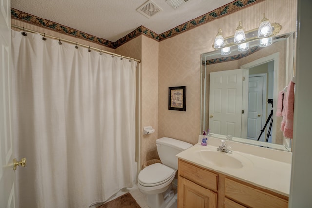 bathroom featuring a textured ceiling, toilet, tile patterned floors, vanity, and curtained shower