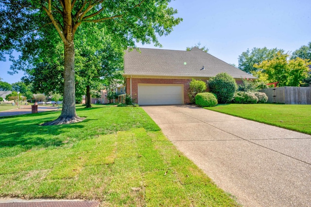 view of front facade featuring a garage and a front lawn