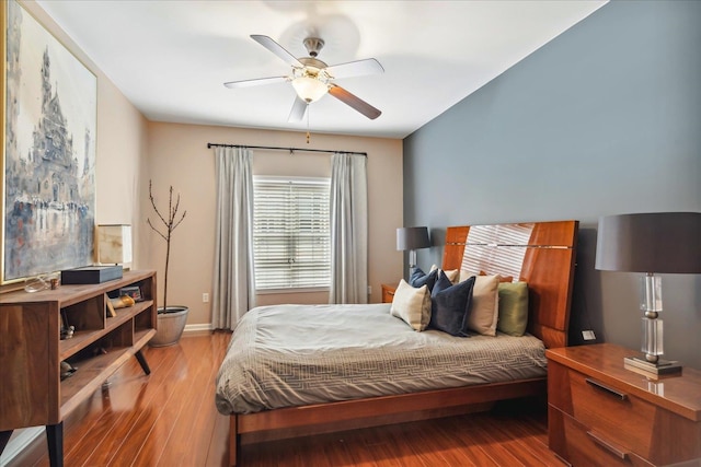 bedroom with wood-type flooring and ceiling fan