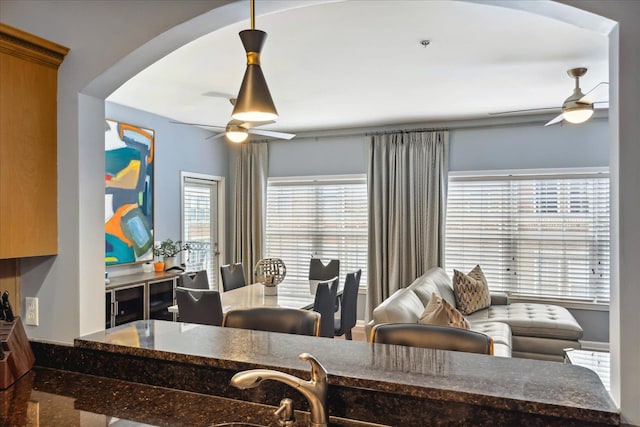 kitchen featuring ceiling fan and a wealth of natural light