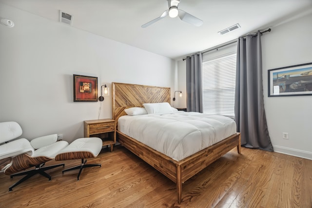 bedroom featuring ceiling fan and light hardwood / wood-style flooring