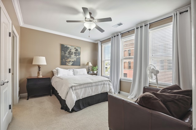 bedroom featuring ornamental molding, light carpet, and ceiling fan