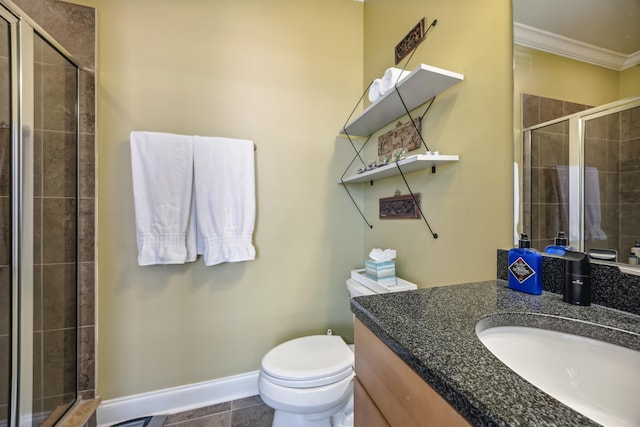 bathroom featuring vanity, ornamental molding, toilet, and an enclosed shower