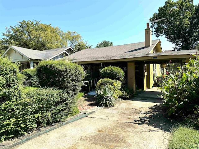 ranch-style home with a carport