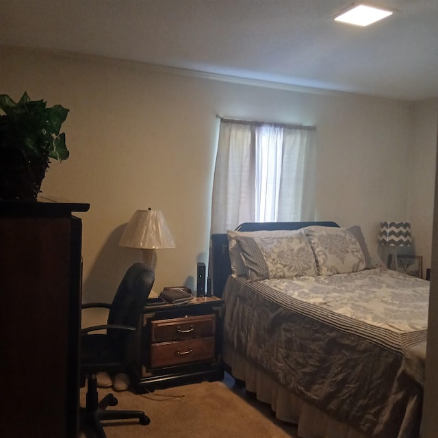 bedroom featuring light colored carpet