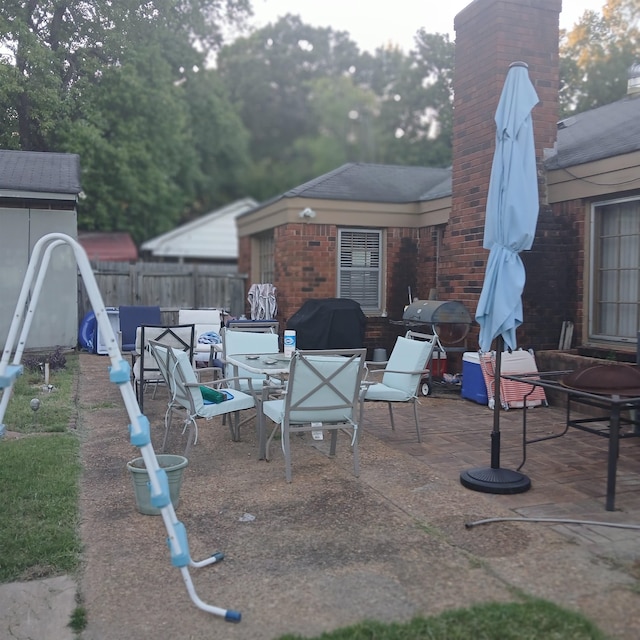 view of patio with a grill