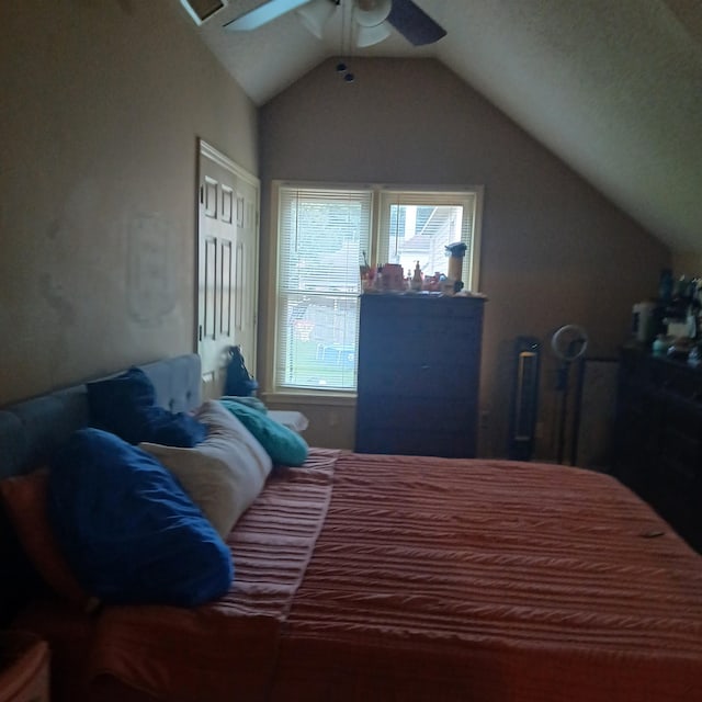 bedroom featuring vaulted ceiling and ceiling fan