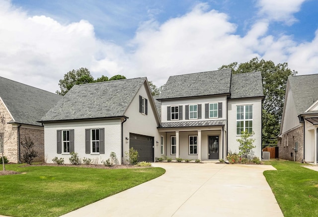 view of front of home with a garage, a front lawn, and central air condition unit