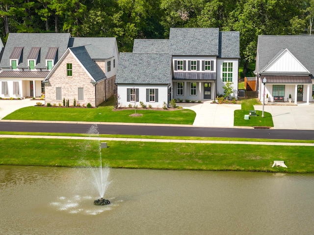 exterior space with a water view