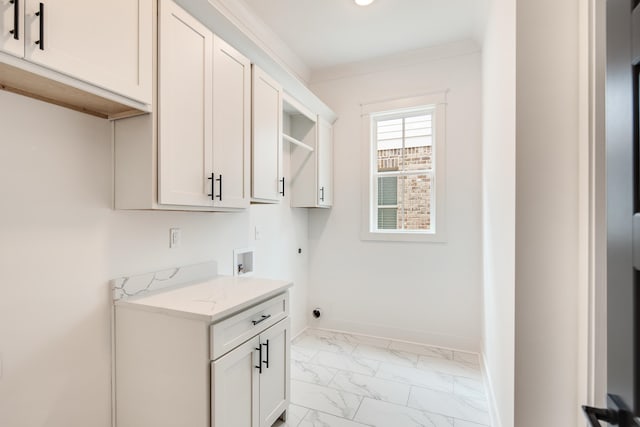 washroom with cabinets, hookup for an electric dryer, hookup for a washing machine, and crown molding