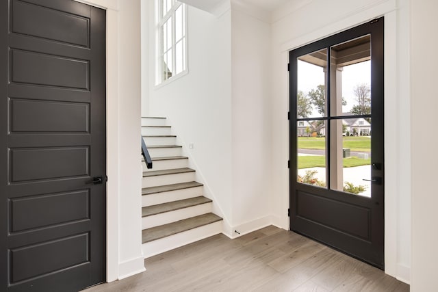 entryway featuring light hardwood / wood-style floors and a healthy amount of sunlight