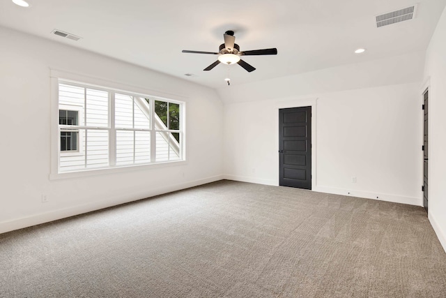 carpeted empty room featuring ceiling fan