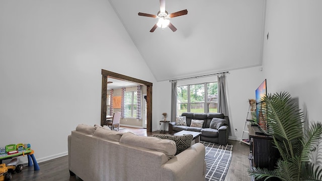 living room featuring ceiling fan, dark hardwood / wood-style flooring, and high vaulted ceiling