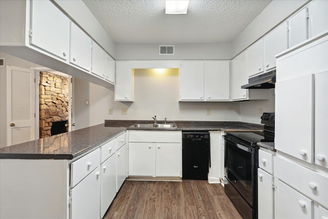 kitchen with white cabinetry, dark hardwood / wood-style flooring, a textured ceiling, black appliances, and sink