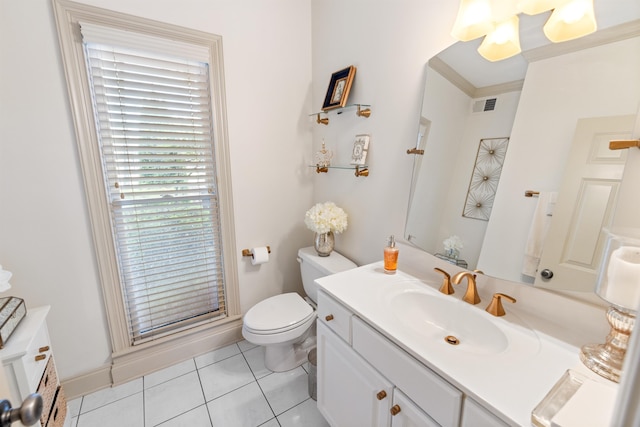 bathroom featuring vanity, an enclosed shower, tile patterned floors, crown molding, and toilet