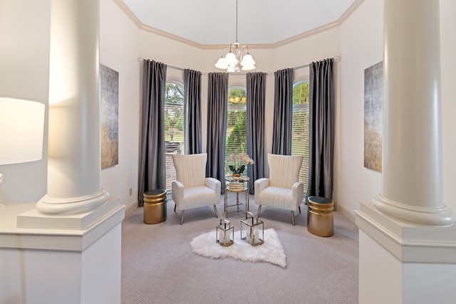 living area featuring an inviting chandelier, plenty of natural light, and ornate columns