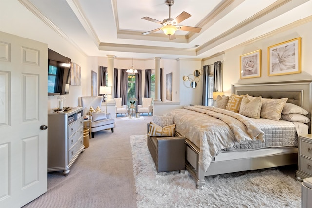 bedroom with ornamental molding, a tray ceiling, ceiling fan, and light colored carpet