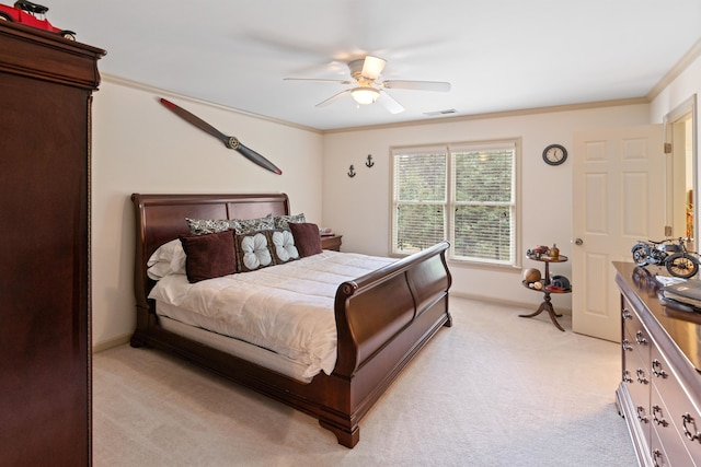 carpeted bedroom with crown molding and ceiling fan