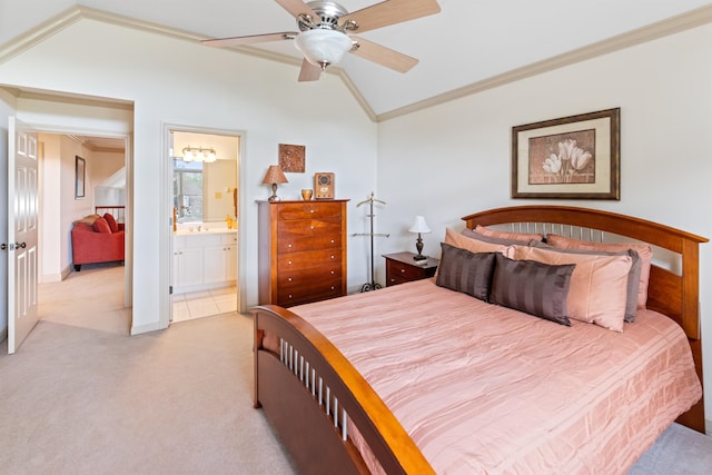 bedroom featuring ceiling fan, ensuite bathroom, light carpet, crown molding, and vaulted ceiling