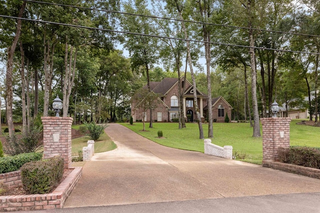 view of home's community with a lawn