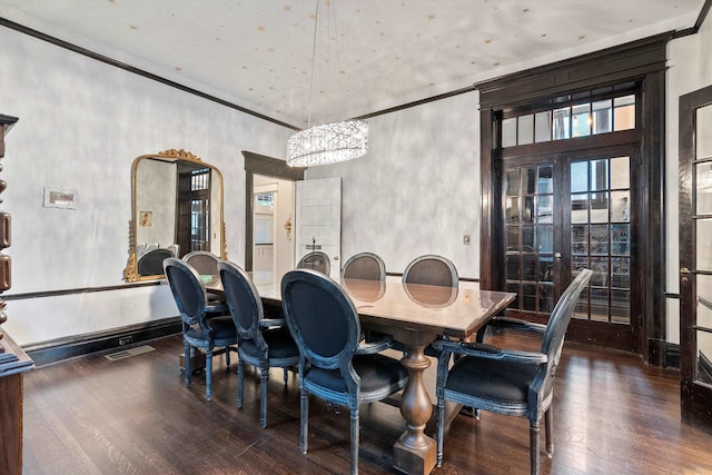 dining area featuring a chandelier, french doors, dark hardwood / wood-style floors, and a high ceiling