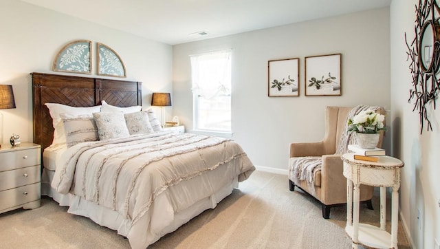 bedroom with light colored carpet