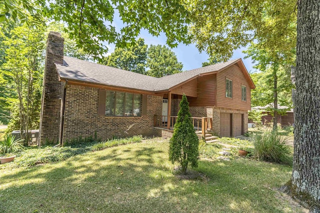 view of front of house with a front yard and a garage