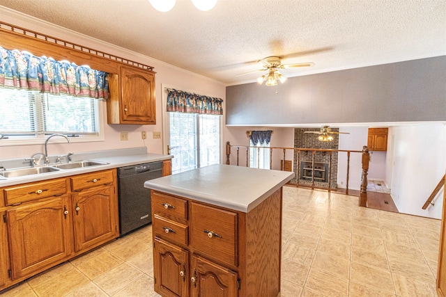 kitchen featuring a center island, dishwasher, sink, and plenty of natural light