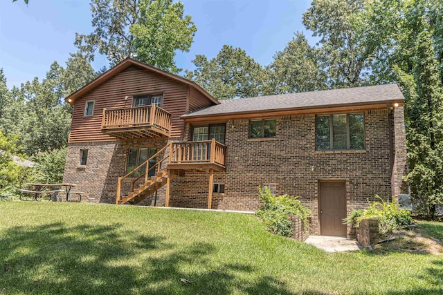 back of property with a lawn and a wooden deck