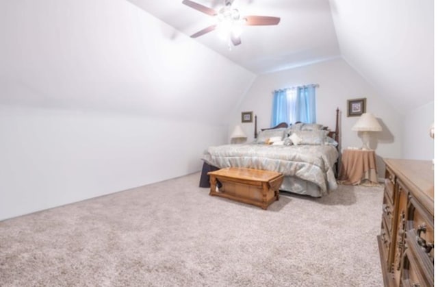 carpeted bedroom featuring vaulted ceiling and ceiling fan