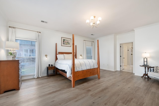 bedroom featuring light hardwood / wood-style floors and ornamental molding