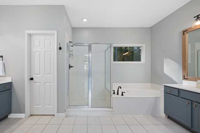 bathroom with shower with separate bathtub, tile patterned floors, and vanity