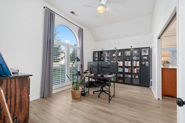 office area with light hardwood / wood-style floors, vaulted ceiling, and ceiling fan