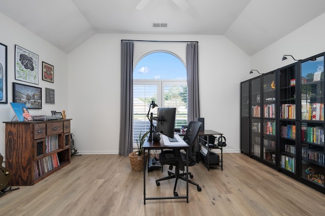 office space with light wood-type flooring, vaulted ceiling, and ceiling fan