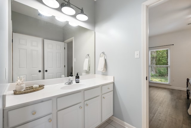 bathroom with hardwood / wood-style flooring and vanity