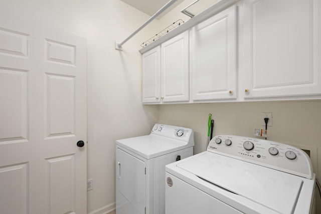 laundry room featuring cabinets and independent washer and dryer