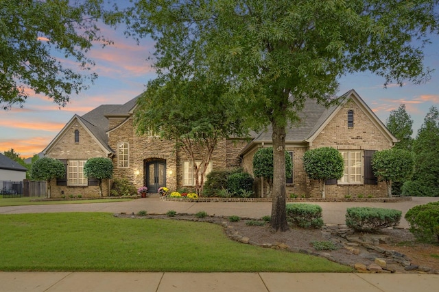 view of front of home with a lawn