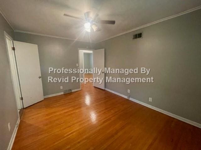 unfurnished room featuring ceiling fan, ornamental molding, and hardwood / wood-style floors