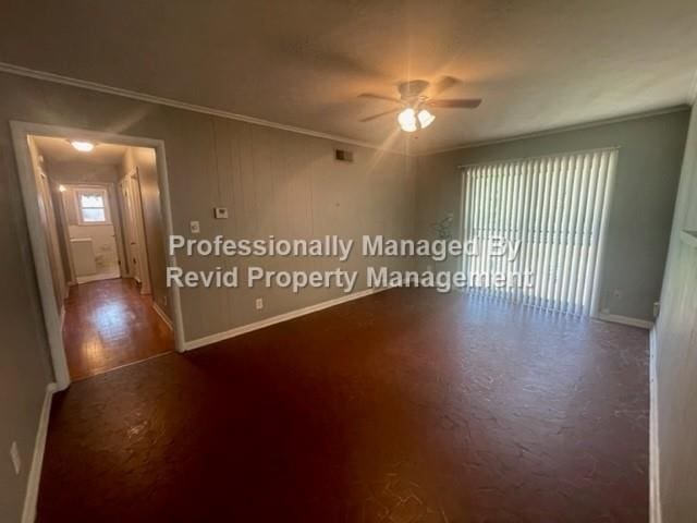 empty room featuring ornamental molding, ceiling fan, and hardwood / wood-style floors