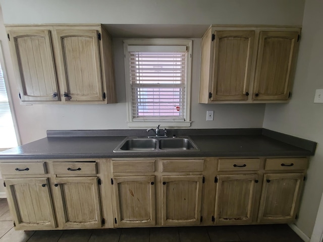 kitchen with sink and tile patterned floors