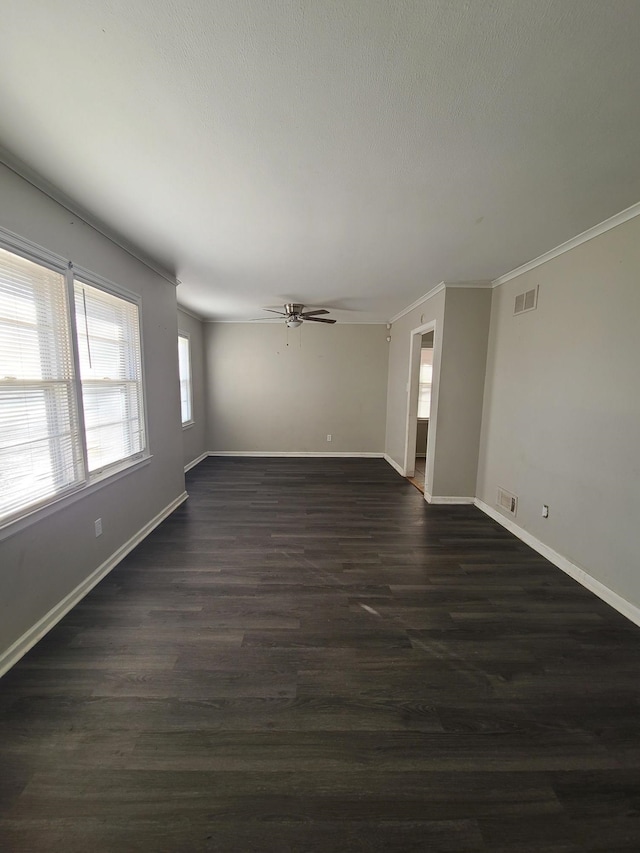 unfurnished room featuring ornamental molding, dark hardwood / wood-style floors, and ceiling fan