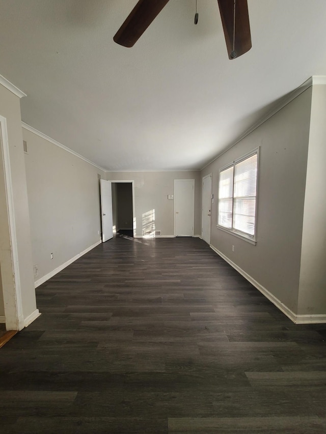 unfurnished living room featuring ornamental molding, ceiling fan, and dark hardwood / wood-style flooring