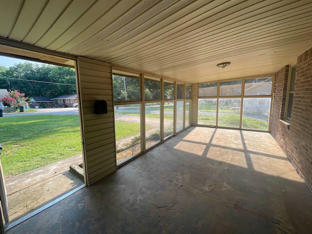 unfurnished sunroom with plenty of natural light