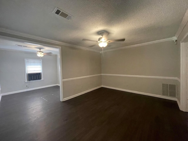 spare room featuring a textured ceiling, ornamental molding, dark hardwood / wood-style floors, and ceiling fan