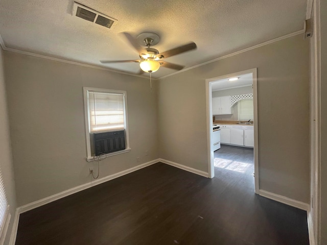 empty room with ceiling fan, cooling unit, sink, a textured ceiling, and dark wood-type flooring