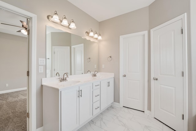 bathroom featuring ceiling fan and vanity