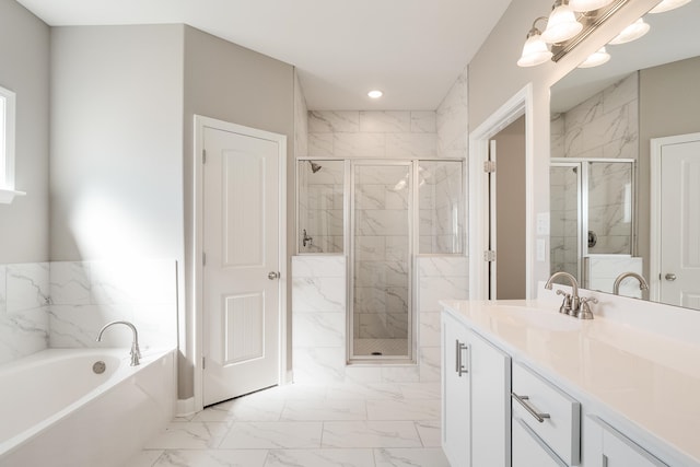 bathroom with vanity and separate shower and tub