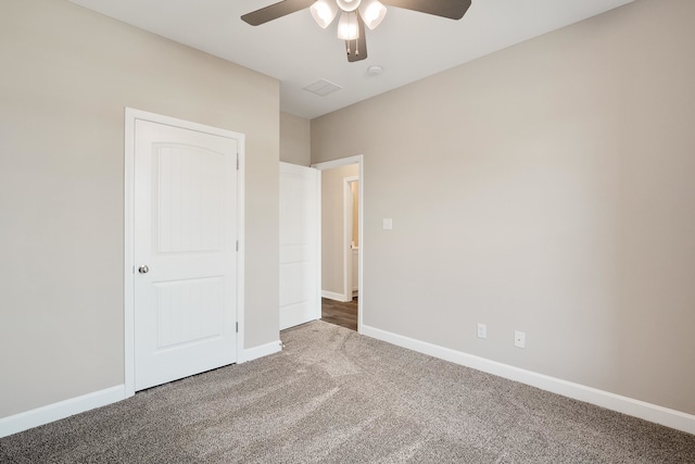 unfurnished bedroom featuring carpet flooring and ceiling fan