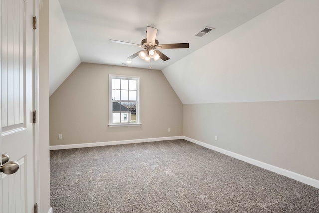 additional living space with lofted ceiling, ceiling fan, and carpet flooring